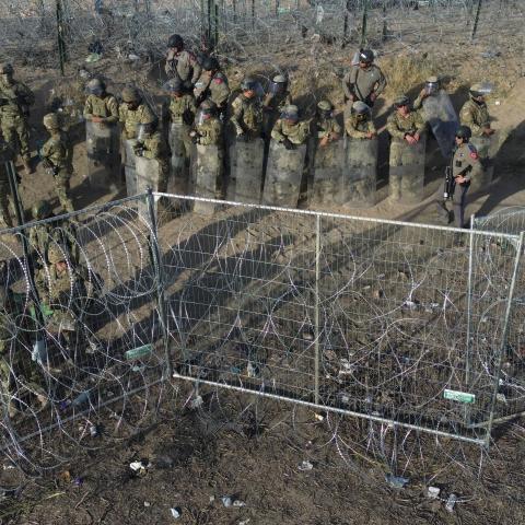 US Border guards deter illegal migrants as they try to cut the razor wire fences put up by the Texas National Guard in Ciudad Juarez, Mexico, on March 22, 2024. (Christian Torres via Getty Images)