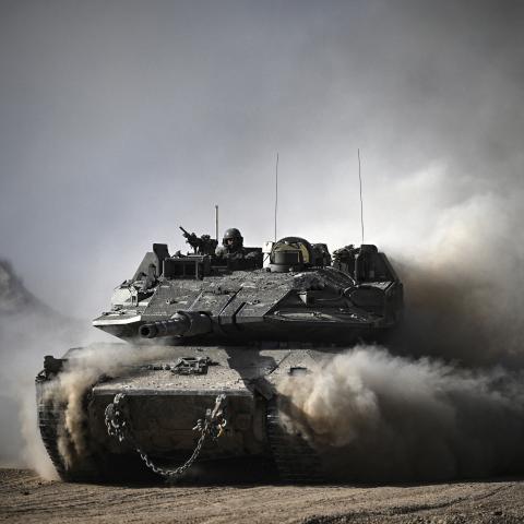 An Israeli tank moves along the border between the Gaza Strip and southern Israel on April 2, 2024. (Ronaldo Schemidt/AFP via Getty Images)