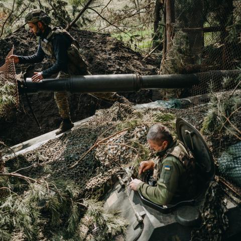 Soldiers from the Ukrainian 63rd Brigade hide an artillery unit in Donetsk Oblast, Ukraine, on April 13, 2024. (Wojciech Grzedzinski via Getty Images)