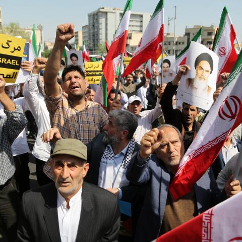 People march with flags and banners to celebrate Iran's attack on Israel on April 19, 2024, in Tehran, Iran. (Fatemeh Bahrami via Getty Images)