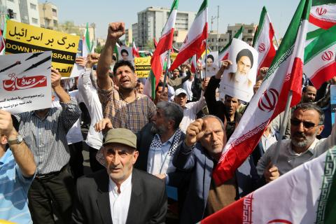 People march with flags and banners to celebrate Iran's attack on Israel on April 19, 2024, in Tehran, Iran. (Fatemeh Bahrami via Getty Images)