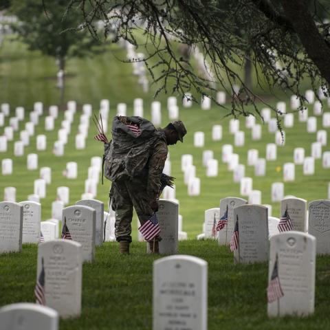 U.S. Army soldiers from the Third U.S. Infantry Regiment (The Old Guard) place flags at gravesites in Arlington National Cemetery in Arlington, Va., during the Flags In ceremony, May 23, 2024.(Elizabeth Fraser/Arlington National Cemetery/U.S. Army)