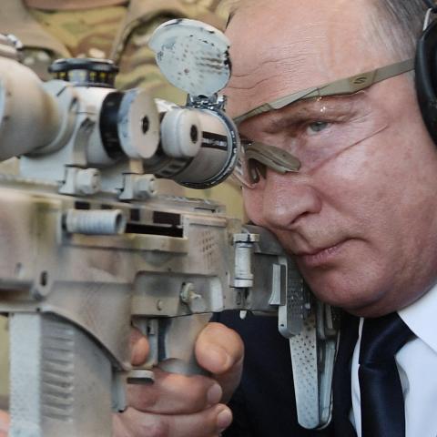 Russian President Vladimir Putin looks through the scope as he shoots a Chukavin sniper rifle during a visit to the military Patriot Park in Kubinka, outside Moscow, on September 19, 2018. (Photo by ALEXEY NIKOLSKY/SPUTNIK/AFP via Getty Images)