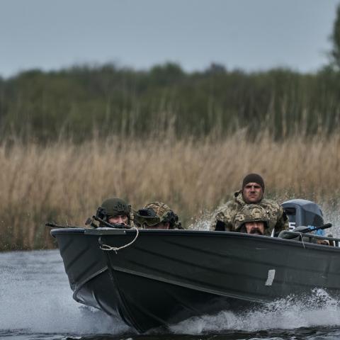 Ukrainian infantrymen from the 126th Territorial Defense Brigade train on the banks of the Dnipro on April 16, 2024, in Kherson Oblast, Ukraine. (Photo by Kostiantyn Liberov/Libkos/Getty Images)