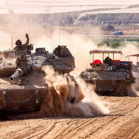 Israeli tanks move near the border with the Gaza Strip on May 13, 2024. (Photo by Jack Guez/AFP via Getty Images)