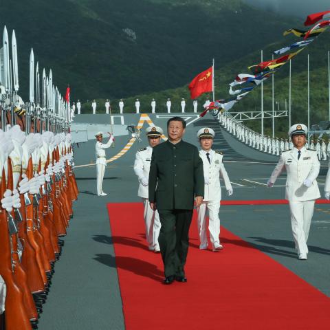 Xi Jinping boards the aircraft carrier Shandong and reviews the guard of honor at a naval port in Sanya, south China's Hainan Province, Dec. 17, 2019. Xi attended the commissioning ceremony of China's first domestically built aircraft carrier, the Shandong, on the same day. The new aircraft carrier, named after Shandong Province in east China, was delivered to the Navy of the Chinese People's Liberation Army and placed in active service at the naval port. TO GO WITH "Profile: Xi Jinping, the man who leads C