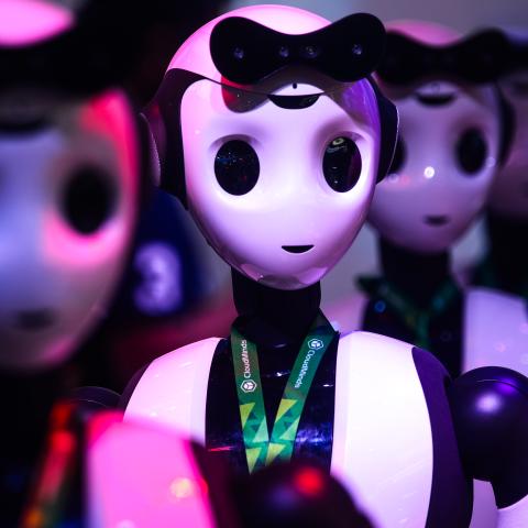 several robots dance at Mintasca intelligence technology company booth during the opening of 2023 World Artificial intelligence conference in Shanghai, China on July 6, 2023 (Photo by Ying Tang/NurPhoto via Getty Images)