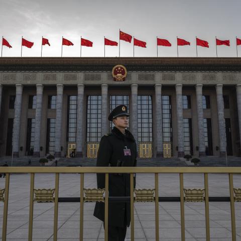 A member of the Peoples Armed Police stands at the entrance of the National Peoples Congress at the Great Hall of the People on March 6, 2024 in Beijing, China. (Photo by Kevin Frayer/Getty Images)