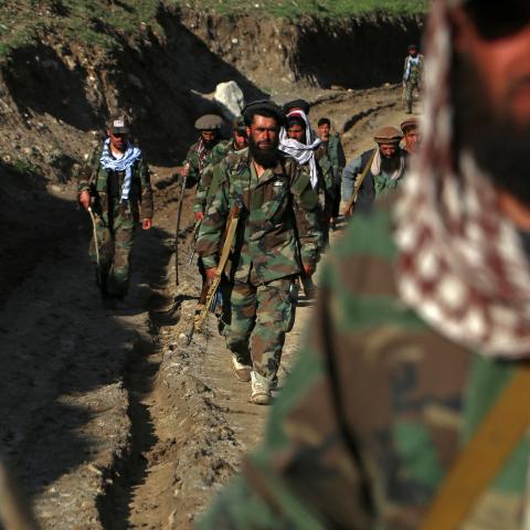 Taliban security personnel arrive to destroy a poppy field in Argo district on May 12, 2024. (Photo by Omer Abrar/AFP via Getty Images)