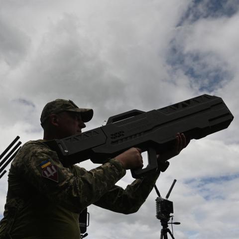 A Ukrainian serviceman tests an anti-drone gun during a presentation of radio-electronic warfare (WB) and radio-electronic intelligence (PER) systems of the Ukrainian company Kvertus in Lviv region on May 28, 2024, amid the Russian invasion of Ukraine. The event was organized by the charity foundation 'Zavzhdy UA' (Forever Ukraine) with the Ukrainian company Kvertus. (Photo by YURIY DYACHYSHYN / AFP) (Photo by YURIY DYACHYSHYN/AFP via Getty Images)