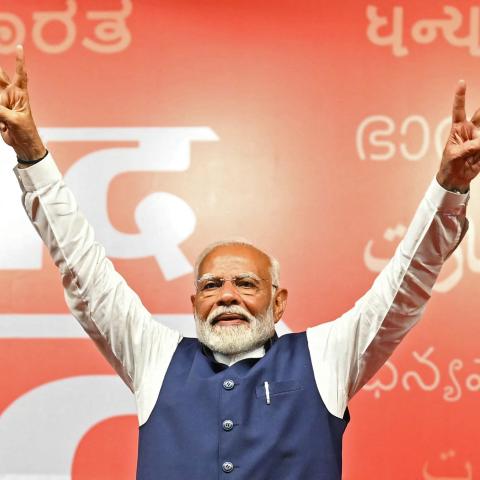 Narendra Modi flashes victory sign in New Delhi on June 4, 2024. (Money Sharma/AFP via Getty Images)