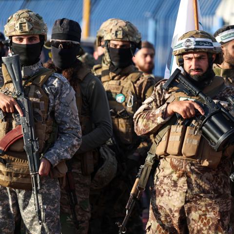 Military fighters affiliated with former Al-Qaeda affiliate Hayat Tahrir al-Sham attend prayer meeting in Idlib, Syria, on June 16, 2024. (Omar Haj Kadour/AFP via Getty Images)