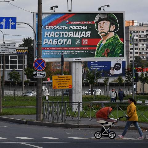 A billboard promoting contract army service with an image of a serviceman and the slogan reading "Serving Russia is a real job" sits in Saint Petersburg on September 20, 2022. (Photo by Olga MALTSEVA / AFP) (Photo by OLGA MALTSEVA/AFP via Getty Images)
