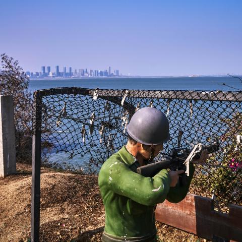 Figure of a Kuomintang soldier looking across at the Chinese city of Xiamen on February 4, 2021, in Lieyu, Taiwan. (An Rong Xu via Getty Images)