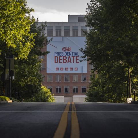 Banners are placed outside of CNN studios ahead of the first presidential debate in Atlanta, Georgia, on June 24, 2024. (Photo by Christian Monterossa/AFP via Getty Images)