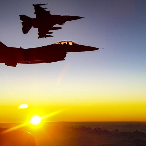 Two US Air Force F-16 Fighting Falcon pilots fly alongside a KC-135R Stratotanker over Southwest Asia on December 4, 2020.