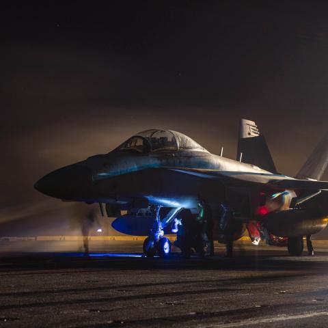 Sailors prepare an E/A-18G Growler for launch aboard the USS Dwight D. Eisenhower in the Red Sea on April 16, 2024. (DVIDS)