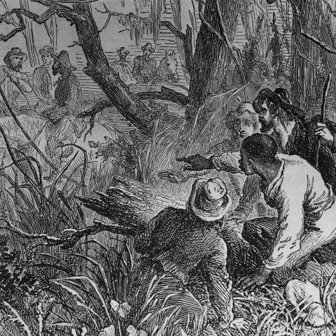 An illustration showing an escaped slave being hidden by helpers on a route using the Underground Railroad, United States, circa 1800. (Three Lions via Getty Images)