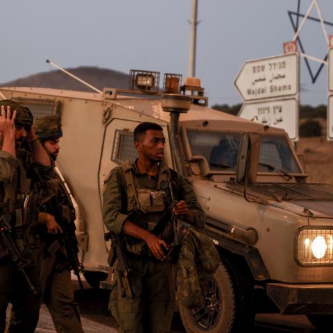 Israeli soldiers secure a road as rockets are launched from southern Lebanon in Golan Heights on July 9, 2024. (Jalaa Marey/AFP via Getty Images)