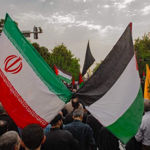 Iranians attend a funeral procession for late Hamas leader Ismail Haniyeh, in Tehran, the Capital of Iran on August 1, 2024. Hamas said its political leader was killed in an Israeli strike in Iran early on July 31, where he was attending the swearing-in of the new president. (Photo by Hossein Beris / Middle East Images / Middle East Images via AFP) (Photo by HOSSEIN BERIS/Middle East Images/AFP via Getty Images)