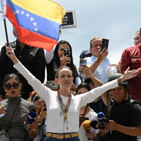 Venezuelan opposition leader María Corina Machado holds a national flag during a protest calling for the recognition of election "victory" in Caracas, Venezuela, on August 17, 2024. (Federico Parra/AFP via Getty Images)