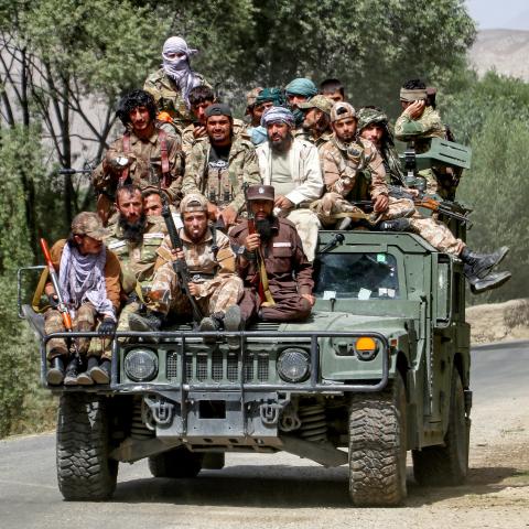 Armed Taliban security personnel sit atop a humvee armored vehicle, as they ride along a street in Khash district, Badakhshan province on September 1, 2024. (Photo by OMER ABRAR / AFP) (Photo by OMER ABRAR/AFP via Getty Images)