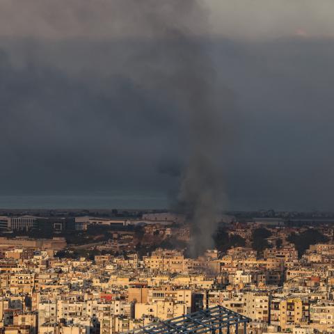 A plume of smoke rises over Beirut's southern suburbs on September 28, 2024, after an Israeli bombardment targeted Hezbollah chief Hassan Nasrallah. (Anwar Amro/AFP via Getty Images)