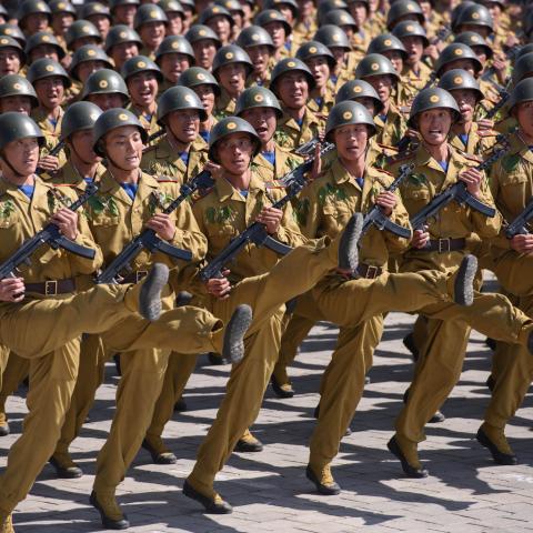 Korean People's Army (KPA) soldiers march during a mass rally on Kim Il Sung square in Pyongyang on September 9, 2018. North Korea held a military parade to mark its 70th birthday, but refrained from showing off the intercontinental ballistic missiles that have seen it hit with multiple international sanctions. (Photo by Ed JONES / AFP) (Photo by ED JONES/AFP via Getty Images)