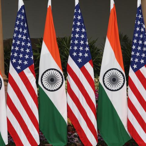 Use this for the caption: Flags on display at an India–United States summit meeting on February 25, 2020, in New Delhi. (Pallava Bagla via Getty Images)