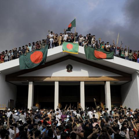 Anti-government protestors storm Prime Minister Sheikh Hasina's palace in Dhaka, Bangladesh, on August 5, 2024. (K M Asad/AFP via Getty Images)