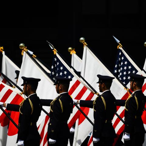 Soldiers hold US and Japanese flags during a welcome ceremony for US President Donald Trump and First Lady Melania Trump at the Imperial Palace in Tokyo on May 27, 2019. (Photo by Brendan SMIALOWSKI / AFP) (Photo credit should read BRENDAN SMIALOWSKI/AFP via Getty Images)