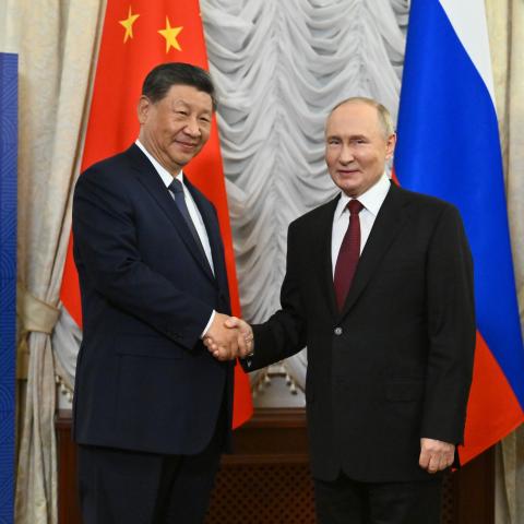 Vladimir Putin and Xi Jinping shake hands at the BRICS Summit in Kazan, Russia, on October 22, 2024. (Kristina Kormilitsyna/Anadolu via Getty Images)