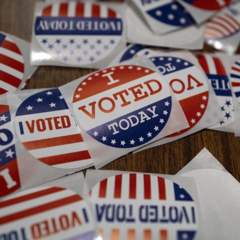 Stickers sit on a table during in-person absentee voting on November 1, 2024, in Little Chute, Wisconsin. (Scott Olson via Getty Images)