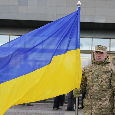 Ukrainian military holds a flag of Ukraine as they receive equipment from Lithuania on November 4, 2024, in Kyiv, Ukraine. (Ihor Kuznietsov/Global Images Ukraine via Getty Images)