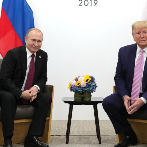 US President Donald Trump (R) meets Russian President Vladimir Putin (L) on the first day of the G20 summit in Osaka, Japan on June 28, 2019. (Photo by Kremlin Press Office / Handout/Anadolu Agency/Getty Images)