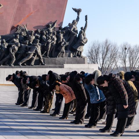  People bow as they visit the statues of late North Korean leaders Kim Il-Sung and Kim Jong-Il to pay their respects on the occasion of the 82nd birthday of late North Korean leader Kim Jong Il, known as the "Day of the Shining Star", on Mansu Hill in Pyongyang on February 16, 2024. (Photo by KIM Won Jin / AFP) (Photo by KIM WON JIN/AFP via Getty Images)