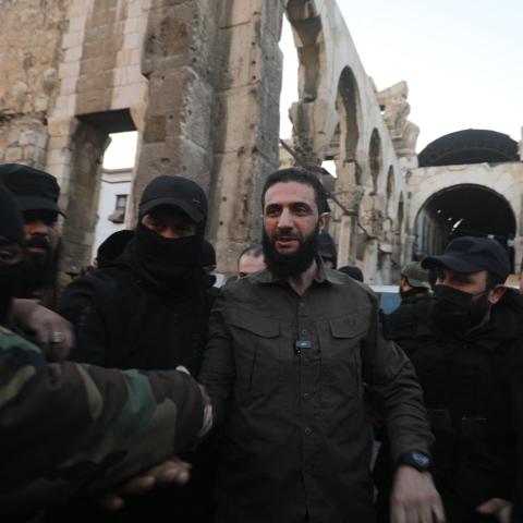 Abu Mohammed al-Jolani, the leader of Syria's Islamist Hayat Tahrir al-Sham group, is welcomed by supporters at the capital's landmark Umayyad Mosque in Damascus, Syria, on December 8, 2024. (Abdulaziz Ketaz/AFP via Getty Images)