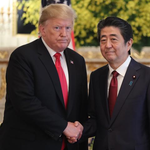 President Donald Trump and Shinzo Abe shake hands prior to their meeting on May 27, 2019, in Tokyo, Japan. (Eugene Hoshiko via Getty Images)