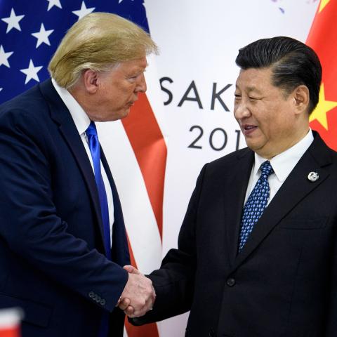 On June 28, 2019, Xi Jinping shakes hands with Donald Trump before a bilateral meeting at the G20 Summit in Osaka. (Brendan Smialowski/AFP via Getty Images)