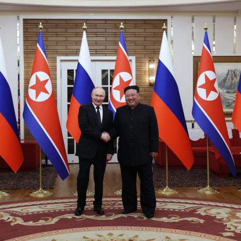 Russia's President Vladimir Putin shakes hands with North Korea's leader Kim Jong Un during a meeting in Pyongyang, North Korea, on June 19, 2024. (Gavriil Grigorov/AFP via Getty Images)