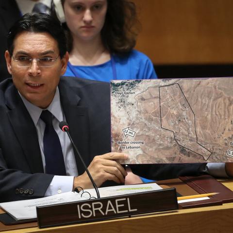 Israeli ambassador to the United Nations Danny Danon holds a map during a United Nations Security Council meeting concerning the situation in the Middle East on April 26, 2018, in New York City. (Drew Angerer via Getty Images)