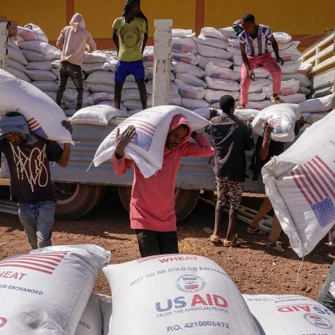Volunteers at the Zanzalima Camp for Internally Displaced People unload 50 kilogram saks of Wheat flour that were a part of an aid delivery from USAID on December 17, 2021 in Bahir Dar, Ethiopia. USAID started delivering food aid to the camp in September 2021 that currently houses over 5000 IDP's. The IDP's housed in this one camp hail from the cities of Dessie, Kombolcha, Hayk, Woldeyia and Sekota and came to the camp to escape the TPLF invasion of the Amhara and Afar regions which is said to be responsibl