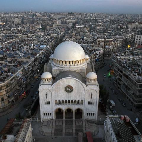 This aerial view shows the Greek Catholic Cathedral of St George, in the northern Syrian city of Aleppo, on December 3, 2024. On November 27, the Islamist Hayat Tahrir al-Sham (HTS) alliance led a major offensive snatching Syria's second city Aleppo and dozens of towns and villages from government control, after years of regime gains in successive Russian-backed military campaigns. (Photo by Omar HAJ KADOUR / AFP) (Photo by OMAR HAJ KADOUR/AFP via Getty Images)