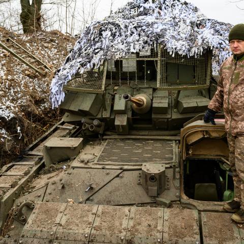 A Ukrainian Army soldier stands on an American Bradley Fighting Vehicle on January 15, 2025, in Sumy, Ukraine. (Photo by Scott Peterson/Getty Images)