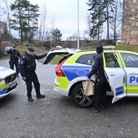 Policemen stand next to their cars in front of an apartment building in Södertälje, south of Stockholm, Sweden, on January 30, 2025, following the shooting of Koran burner Salwan Momika. Momika, who repeatedly burnt the Koran in 2023 in Sweden, sparking outrage in Muslim countries, has been shot dead, media reported on January 30, 2025, with police confirming a man died in a shooting the day before. A Stockholm court was due to rule on January 30, 2025 whether Salwan Momika, a Christian Iraqi who burned Kor