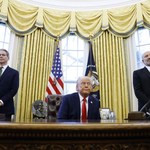 US Secretary of Treasury Scott Bessent and Howard Lutnick, US President Donald Trump's nominee for commerce secretary, stand behind him as he speaks to reporters in the Oval Office of the White House on February 3, 2025, in Washington, DC. (Anna Moneymaker/Getty Images)