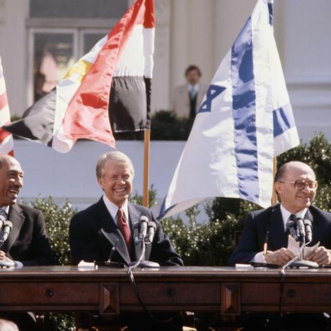 Egyptian President Anwar el-Sadat, US President Jimmy Carter, and Israeli Prime Minister Menachem Begin sit together outside the White House on March 26, 1979. (Wally McNamee/Corbis via Getty Images)