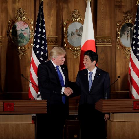 President Donald Trump and Japanese Prime Minister Shinzo Abe shake hands following their meeting at Akasaka Palace in Tokyo, Japan, on November 6, 2017. (Kiyoshi Ota/Anadolu Agency via Getty Images)