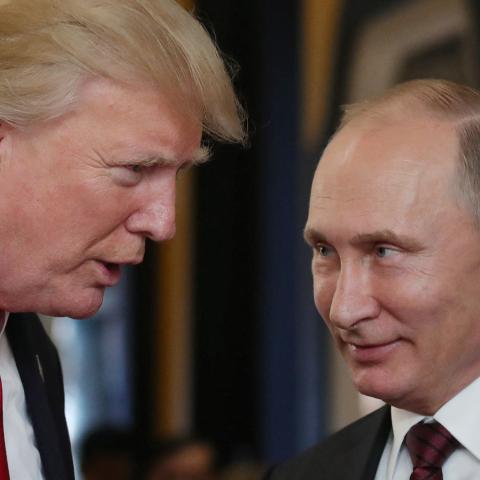 US President Donald Trump chats with Russia's President Vladimir Putin as they attend the Economic Leaders' Meeting in the Vietnamese city of Danang on November 11, 2017.(MIKHAIL KLIMENTYEV/SPUTNIK/AFP via Getty Images)