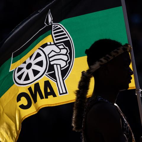 A performer holds an African National Congress flag while listening to Cyril Ramaphosa speak during the ANC Siyanqoba Rally on May 25, 2024, in Johannesburg, South Africa. (Chris McGrath via Getty Images)